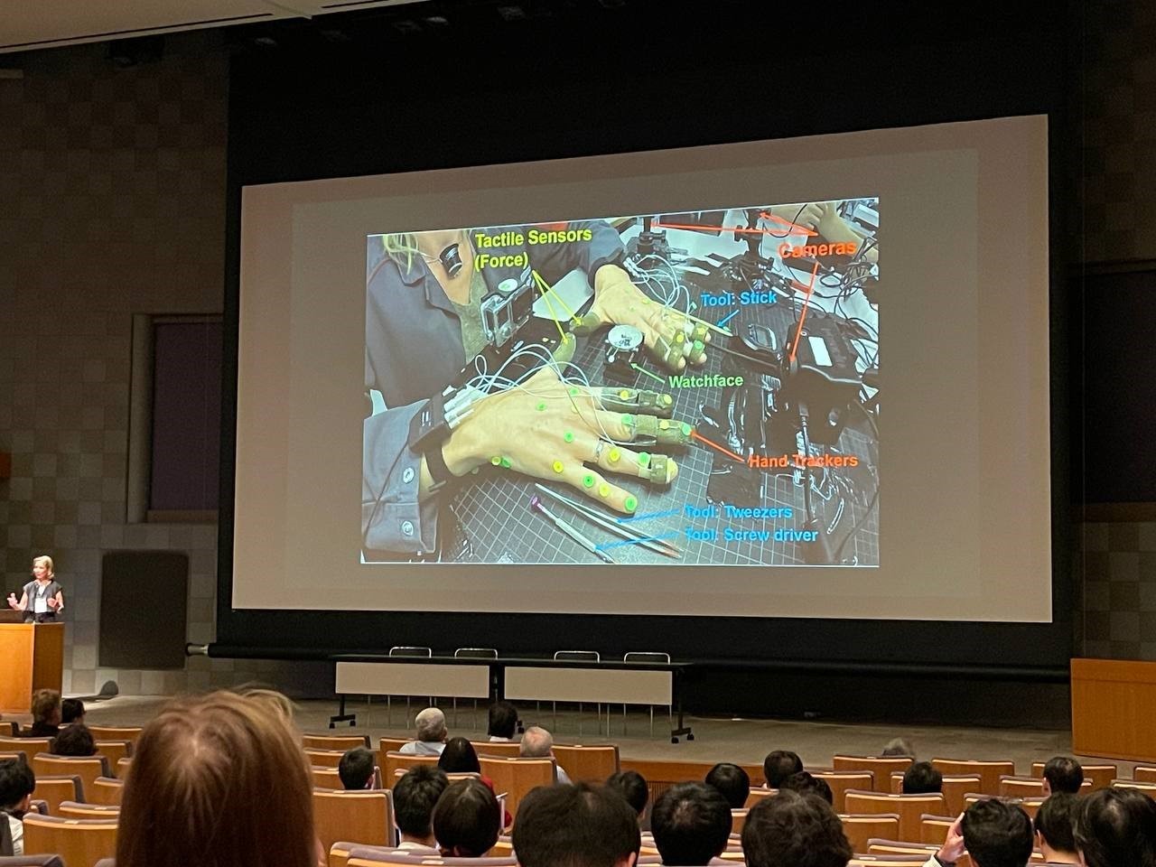 Aude Billard presenting research on robotic dexterity and tactile interaction